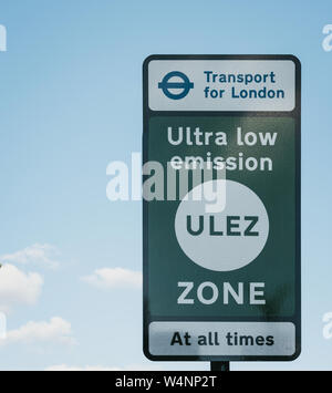 London, UK - July 15, 2019: Sign indicating Ultra Low Emission Zone (ULEZ) in London against blue sky and clouds. ULEZ was introduced in 2019 to help Stock Photo