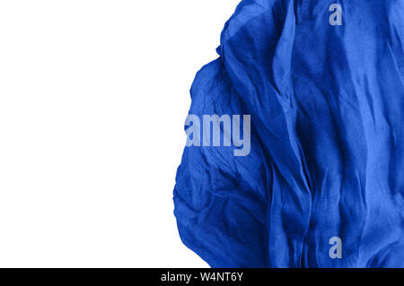 Preparation for the background. Blue fabric. White isolate. Crumpled cotton. Close-up. Stock Photo
