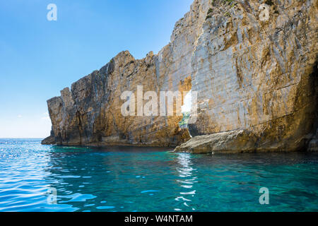 Greece, Zakynthos, Blue sky and perfect turquoise clear water at white stone arch near keri caves Stock Photo