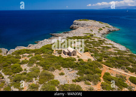 Aerial drone view of the dry summer coastline and crystal clear waters of the Greek island of Crete Stock Photo