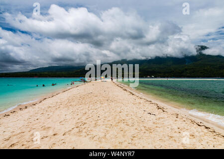 A beauty sand spit off the coast of a green tropical island with towing mountains (White Island, Camiguin) Stock Photo