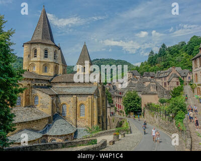 Conques, Midi Pyrenees, France - July 31, 2017: View of the medieval village of Conques and the Abbey Church of Saint Foy Stock Photo