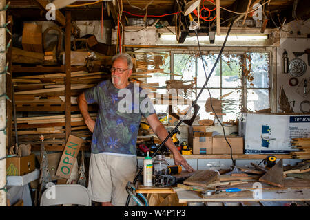 Portrait of a proud craftsman in his workshop Stock Photo