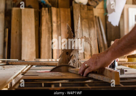 close-up portrait of an craftsman cutting wood with a circular saw Stock Photo