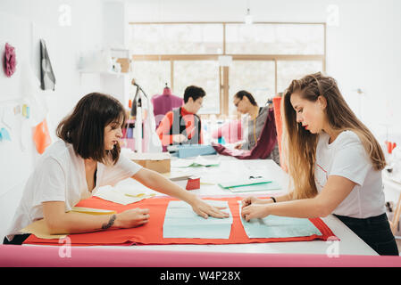 Fashion designers working in the design studio Stock Photo