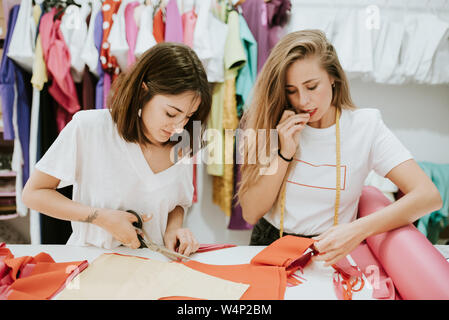 Fashion designers working together in the design studio Stock Photo