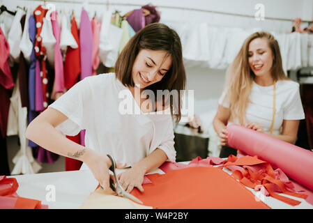 young women working together in a design studio. they laught Stock Photo