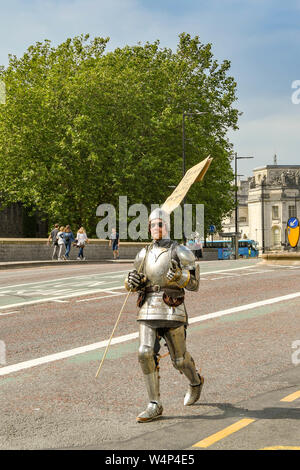 CARDIFF, WALES - JULY 2019: Protester dressed as a knight in shining armour at the Climate Emergency protest by Extinction Rebellion in Cardiff Stock Photo