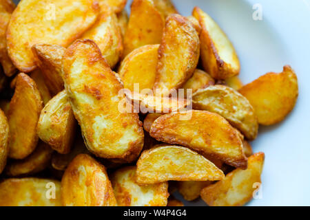 potato wedges on white plate Stock Photo