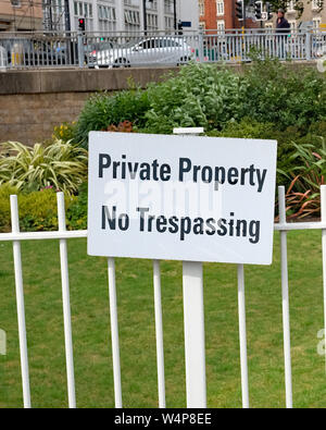July 2019 - Private Property - No Tespassing sign on a urban grden in Bristol near the harbourside developments Stock Photo