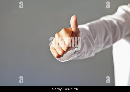 Doctor dressed in white doing the okey. Stock Photo