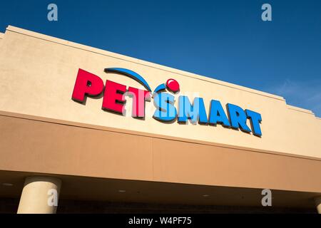 Close-up of logo and sign on facade of Petsmart pet supply store in Dublin, California, July 23, 2018. Stock Photo