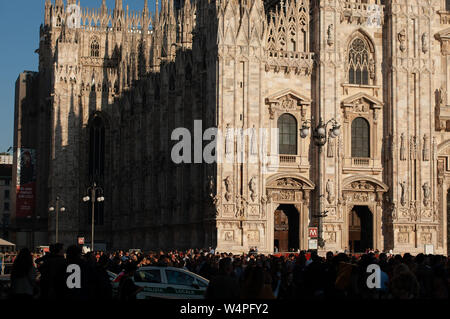 Milan, Italy - March 23, 2019: Duomo. People in front of facade of italian gothic church in the centre of Milan, Italy. Festival or celebration Stock Photo