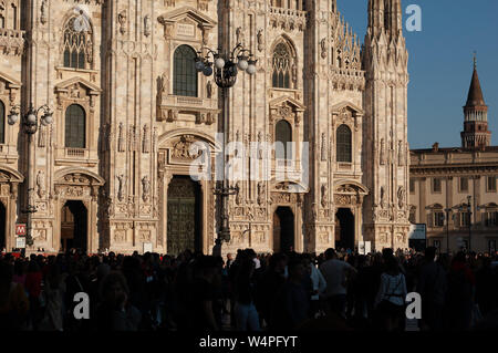 Milan, Italy - March 23, 2019: Duomo. People in front of facade of italian gothic church in the centre of Milan, Italy. Festival or celebration Stock Photo