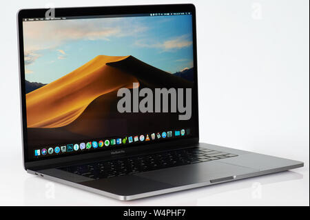 New york, USA - july 24, 2019: Side view of modern macbook pro isolated on studio background Stock Photo