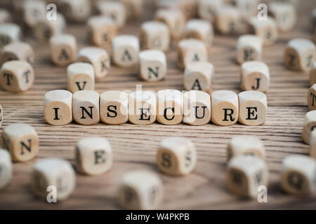 dice forming the word INSECURE Stock Photo