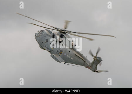 A British Royal Navy Agusta Westland Merlin HM2 helicopter participating in the flying display at Yeovilton Air Day, UK on the 13th July 2019. Stock Photo