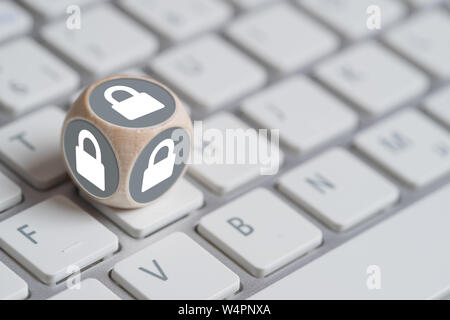 cube with lock symbols on a keyboard Stock Photo