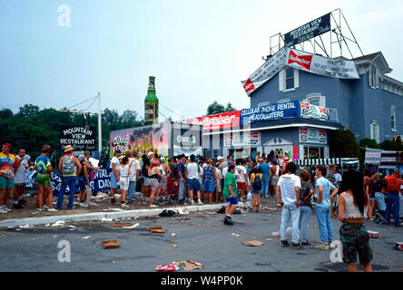 Saugerties, New York, USA, August, 1994Massive crowds fill the muddy fields at the Winston Farm during Woodstock 94 a music festival to commemorate the 25th anniversary of the original Woodstock festival. People wait in line to buy beer at the closest store to the festival. Credit:  Mark Reinstein / MediaPunch Stock Photo