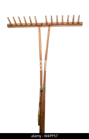 Old garden rake on white background Stock Photo