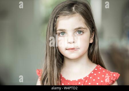 6-year-old girl looks into the camera, Portrait, Germany Stock Photo