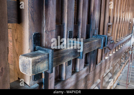 Old prison locked wooden key, wooden gate lock Stock Photo