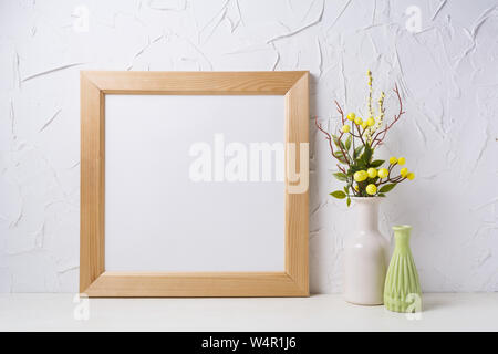 https://l450v.alamy.com/450v/w4r1j6/wooden-square-picture-frame-mockup-with-yellow-decorated-branches-and-green-vase-empty-frame-mock-up-for-presentation-design-template-framing-for-mo-w4r1j6.jpg