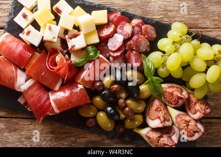 Foodie Charcuterie Board with Cheese Olives Pears Grapes Prosciutto Figs  Apples Cantalupe Nuts Burgundy Wrapping Paper by River Oak Studio