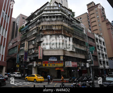 July 24, 2019, Taipei, Taiwan: A taxi passes through an intersection near Taipei Main station. Taipei is the capital and a special municipality of Taiwan. Located in the northern part of the island of Taiwan. According to Wikipedia, the city is home to an estimated population of 2,704,810 people. In Taipei you can still see old structures and buildings, but the city also seems to be making very rapid progress in its modern infrastructure. Photograph taken on Wednesday, July 24, 2019. Photo by: Ramiro Agustin Vargas Tabares. Credit: Ramiro Agustin Vargas Tabares/ZUMA Wire/Alamy Live News Stock Photo