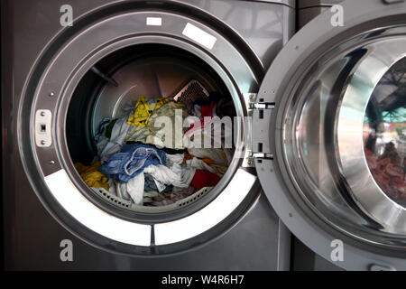 Photo of washed clothes or laundry inside a spin dryer machines Stock Photo
