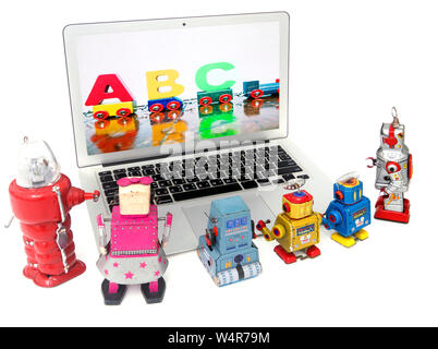 robot toys learing ABC on a laptop computer isolated image Stock Photo