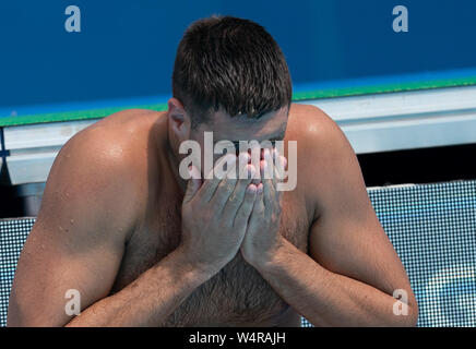 Gwangju, South Korea. 25th July, 2019. Swimming World Championship: Water polo placement round 5-8, Serbia - Germany: Goalkeeper Moritz Schenkel sits at the edge of the pool. Germany lost in the five-meter throw with 16:17. Credit: Bernd Thissen/dpa/Alamy Live News Stock Photo