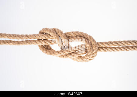 Double Figure Eight knot on white background. Rope node Stock Photo