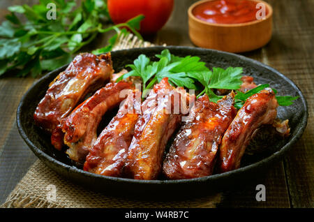 Grilled sliced pork ribs in frying pan Stock Photo