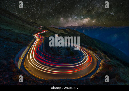 Vehicle light trails at night, Hualien County, Taiwan Stock Photo