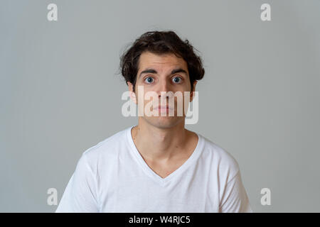 Thinking funny faces. Portrait of worried young man confused. Thoughtful male thinking in new ideas, creative ways to success, learning new languages Stock Photo