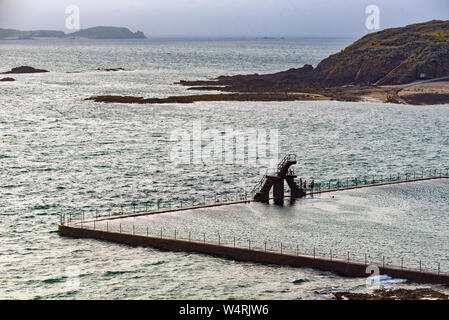 Famous outdoor swimming pool with jumping platform in Saint-Malo, Brittany, France Stock Photo