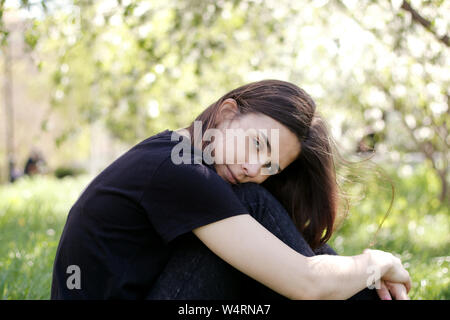 cute girl dream in the green park Stock Photo