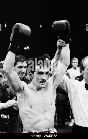 Barry McGuigan's comeback fight against Nicky Perez,  Alexandra Pavillion, London.This was McGuigan's first fight after losing his WBA World Title to Steve Cruz. McGuigan won by KO in round four. (Picture shows) McGuigan celebrating his win after the fight. 4th April 1988. Stock Photo