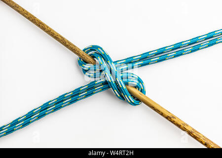 Double Clove Hitch Knot isolated on wooden background. Rope node Stock ...