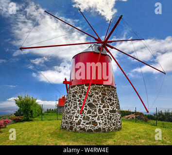 Old windmill near Conceicao (Faial, Azores) with volcano Pico in background Stock Photo