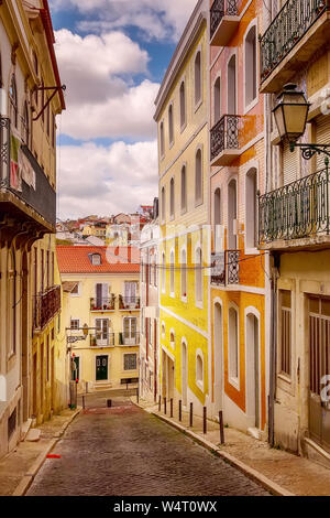 Lisbon, Portugal street perspective view with colorful traditional houses Stock Photo