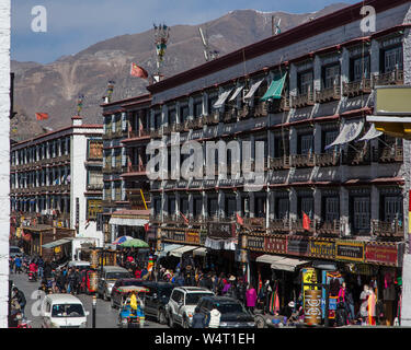 China, Tibet, Lhasa, Apartments and traffic on Beijing East Road. Stock Photo
