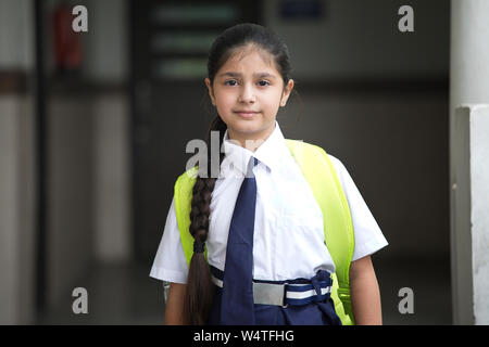 Portrait of schoolgirl standing at school campus Stock Photo - Alamy