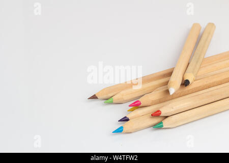 Colored pencils lies on a white background Stock Photo