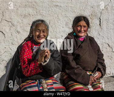 China, Tibet, Lhasa, Two Khamba Tibetan women from the Kham region of eastern Tibet on a pilgrimage to visit holy sites  they are wearing their colorful traditional bangdian or pangden aprons. Stock Photo