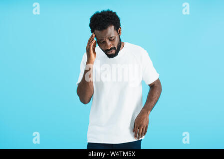 african american man having headache isolated on blue Stock Photo