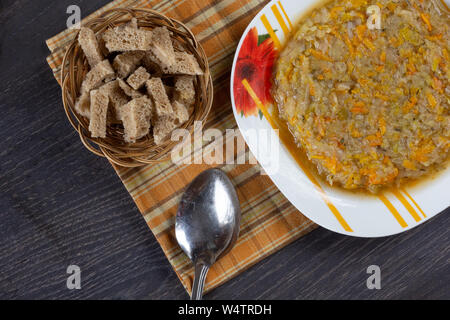 Stewed cabbage with carrot and onion on the plate Stock Photo