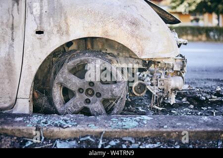 Problem on road. Car after accident with fire. Close-up of burnt vehicle wheel. Stock Photo