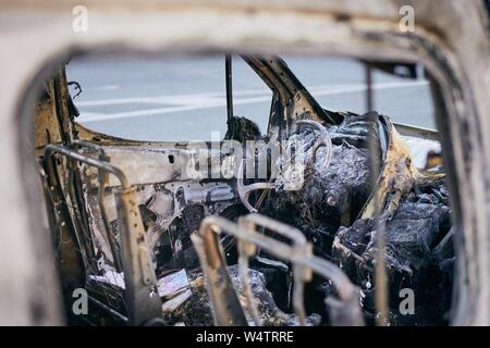Problem on road. Car after accident with fire. Close-up of burnt vehicle steering wheel. Stock Photo